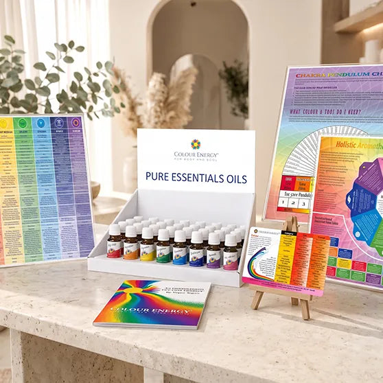 Colour therapy charts and a Colour Energy essential oils display in a practitioner's studio