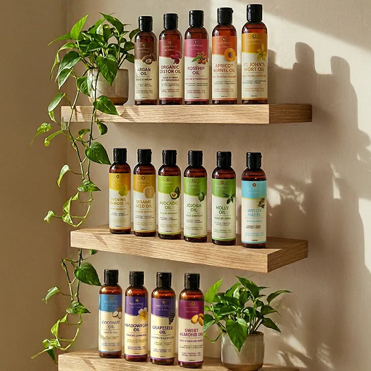 Aromatherapy carrier oils displayed on wooden shelves
